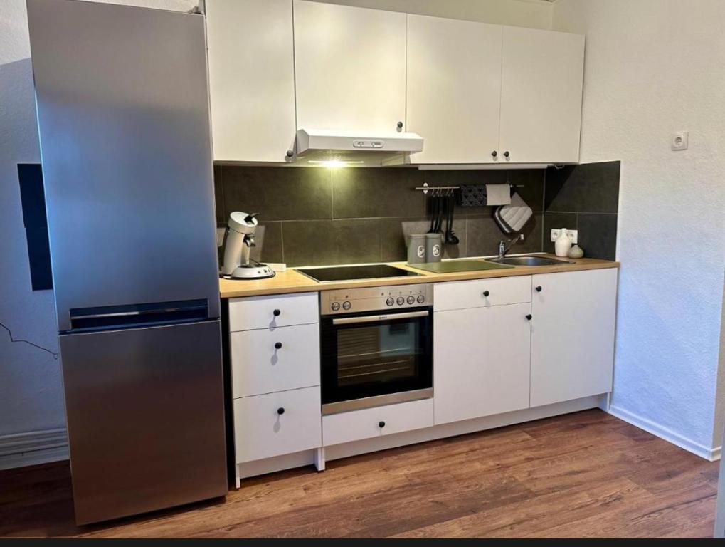 Kuchyň nebo kuchyňský kout v ubytování Kleine Hafenperle