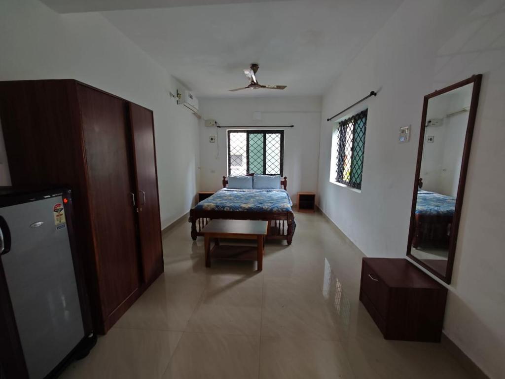 En eller flere senge i et værelse på Carvalhos Regina guest house