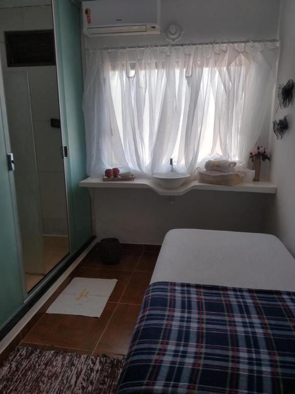 En eller flere senge i et værelse på Cantinho Da Josete Apartamento