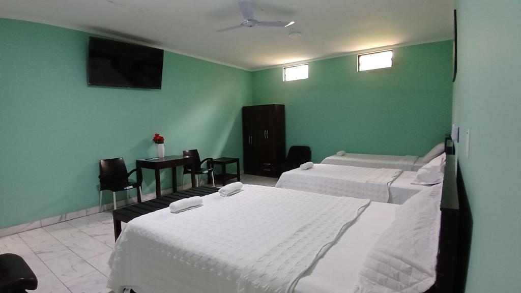 En eller flere senge i et værelse på LOMAS de SAUCE