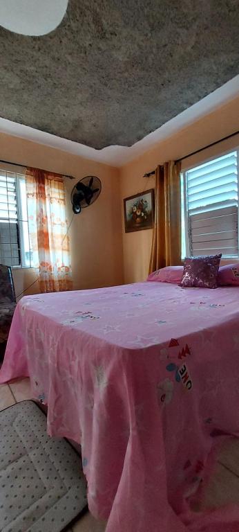 En eller flere senge i et værelse på Content Guest House