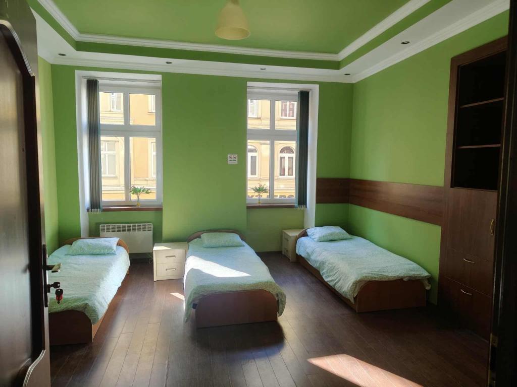 En eller flere senge i et værelse på Noclegi Juliusz Slowacki 6