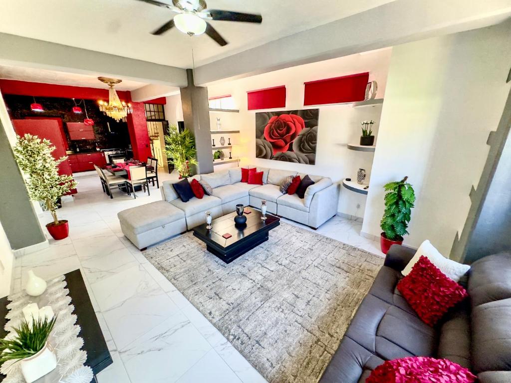 a living room with a couch and a table at Casa Chevere in Puerto Vallarta