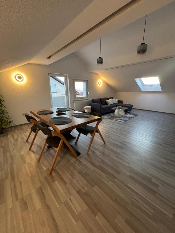 a living room with a table and a couch at Forest Home E&L in Waldshut-Tiengen