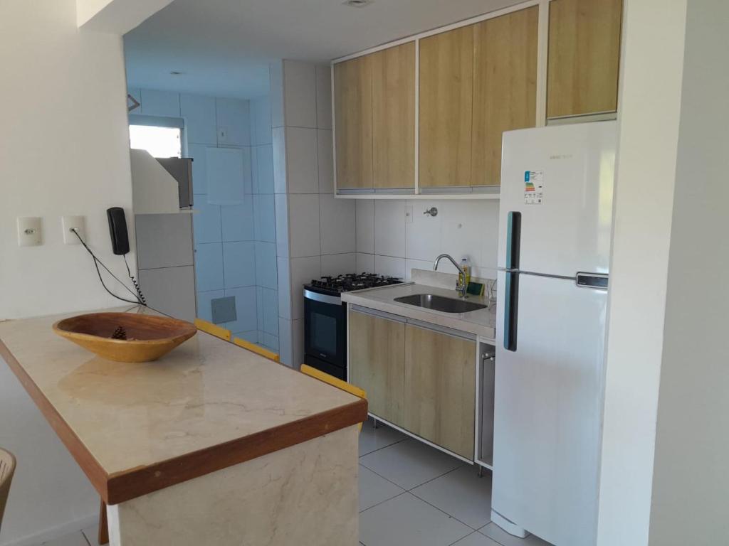 Køkken eller tekøkken på Aluguel de Temporada Bosque de Guarajuba