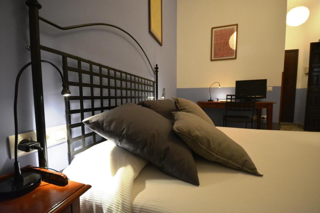 Postel nebo postele na pokoji v ubytování Hotel Casa de los Azulejos