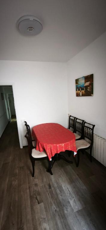 a room with a table with a red table cloth on it at Playa de Sant Adrià de Besòs in Sant Adria de Besos