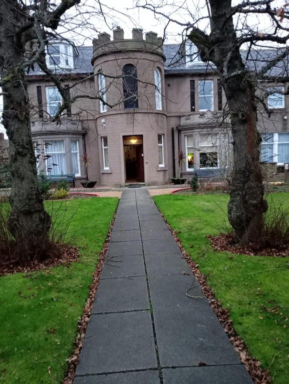 a large house with a pathway in front of it at The Limes Guesthouse Montrose in Montrose
