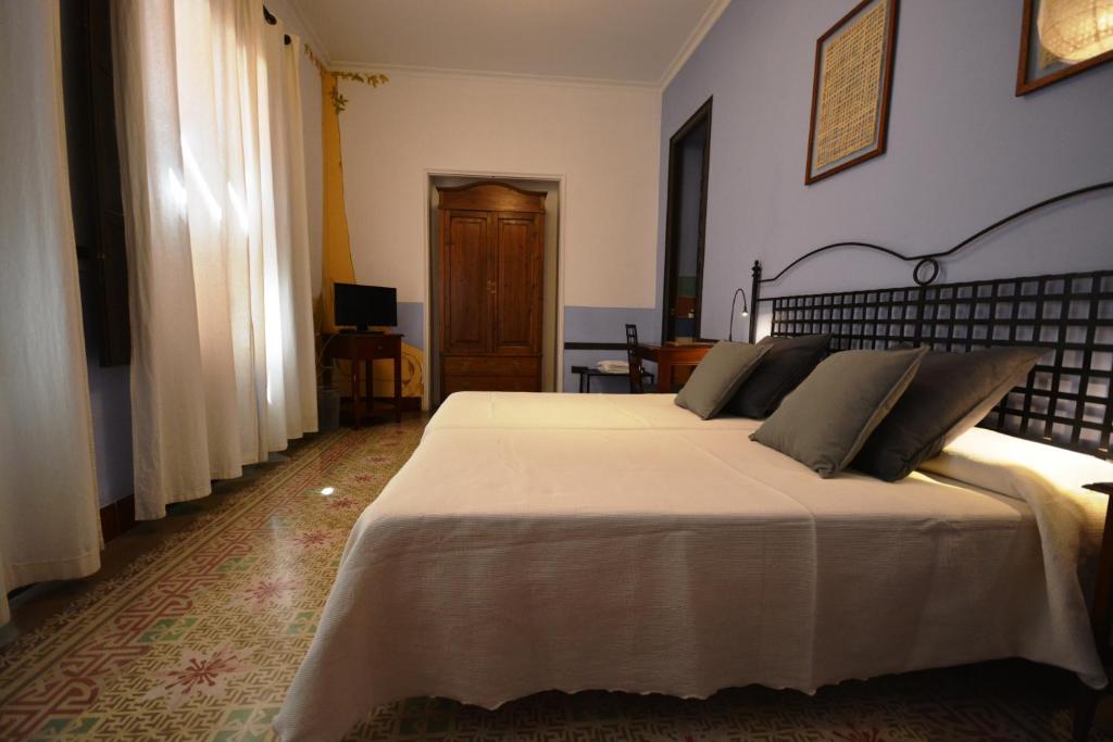 Postel nebo postele na pokoji v ubytování Hotel Casa de los Azulejos