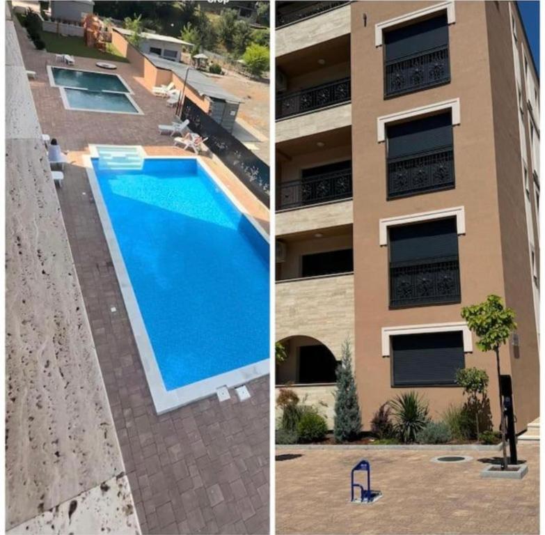 a building with a swimming pool next to a building at Royal Queen in Vrnjačka Banja