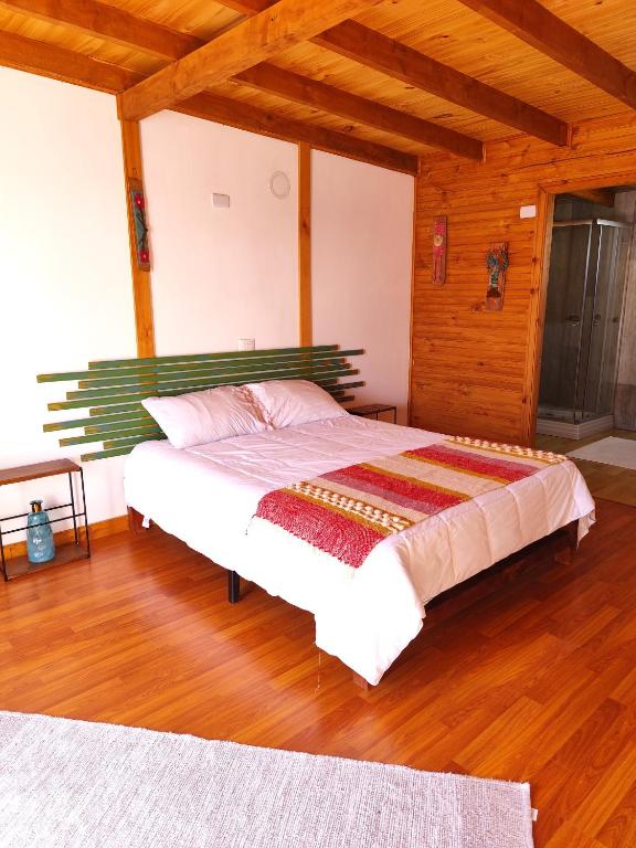 En eller flere senge i et værelse på Cabaña