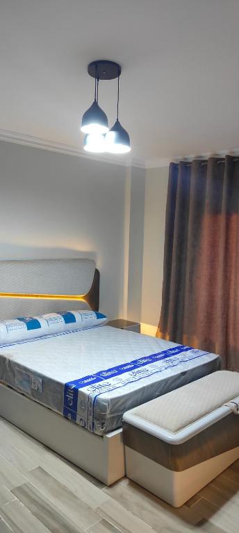 two twin beds in a room with a window at كومباوند وصال الشروق in Madīnat ash Shurūq