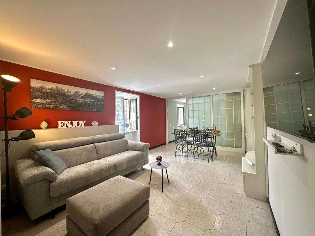 a living room with a couch and a table at Como Lake, lakefront 30m in Como