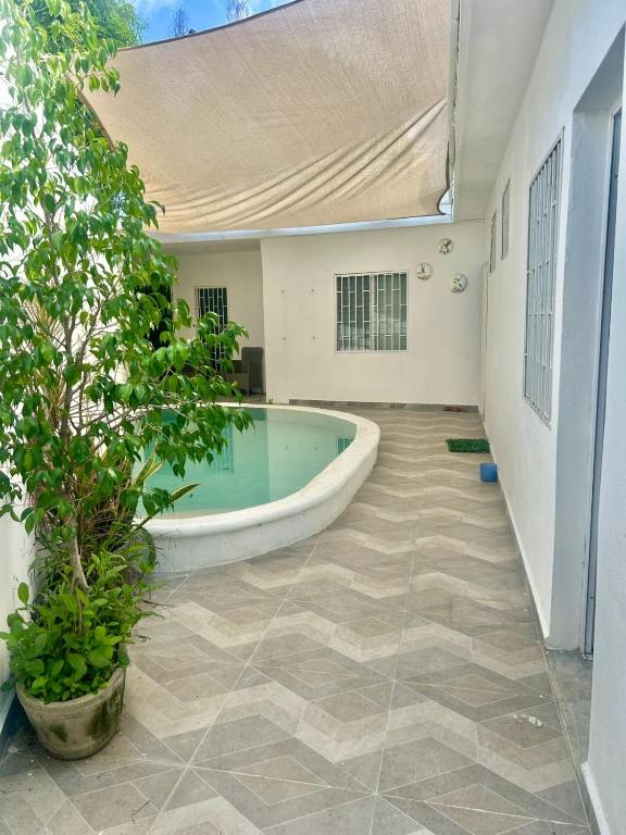 a swimming pool in the middle of a house at Casa Ich in Valladolid