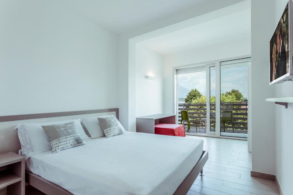 Postel nebo postele na pokoji v ubytování Hotel Stella del Benaco
