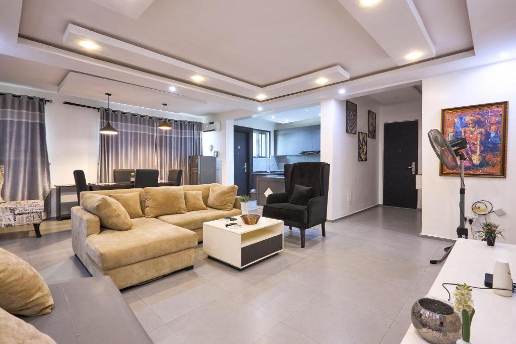 a living room with a couch and a table at The Haven in Lekki