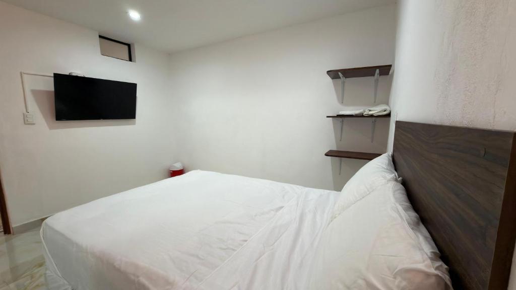 Un pat sau paturi într-o cameră la Aldea mi Casa