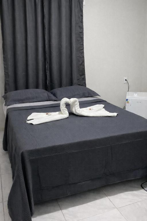 En eller flere senge i et værelse på Pousada Vale dos Buritis