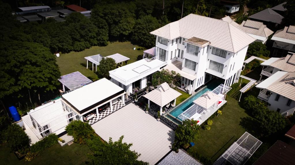an overhead view of a large white house at Phangan Cove Pool Villas in Srithanu