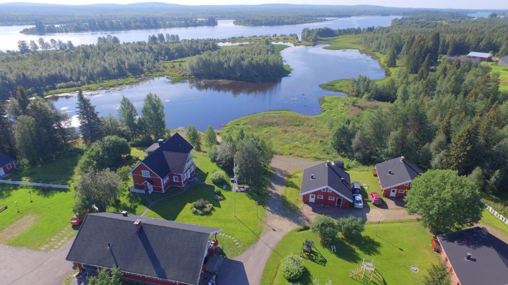 an aerial view of a house and a lake at Holiday Village Kuukiuru in Vuostimo