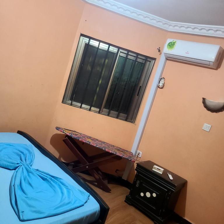 Llit o llits en una habitació de Résidence Dema 2
