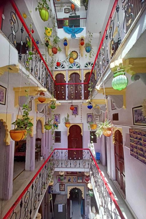 an overhead view of a building with potted plants at Nukkad Guest House Near Lake Pichola in Udaipur