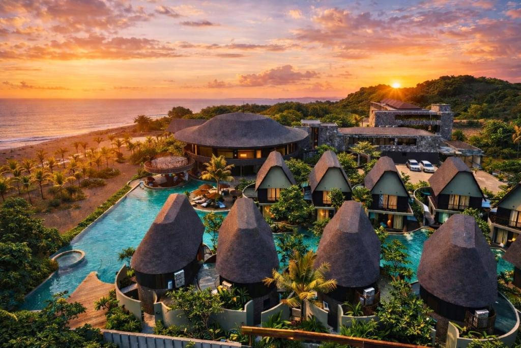 an aerial view of the resort at sunset at Quenzo Beach Resort in Padangbai