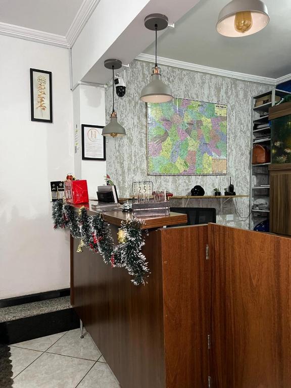 a kitchen with a counter with christmas decorations on it at Hostel Anprado #6 kit café incluso, Próx-Aeroporto de Guarulhos in Guarulhos