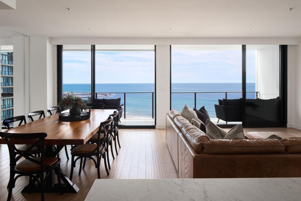 a living room with a couch and a table at The Outlook in Newcastle