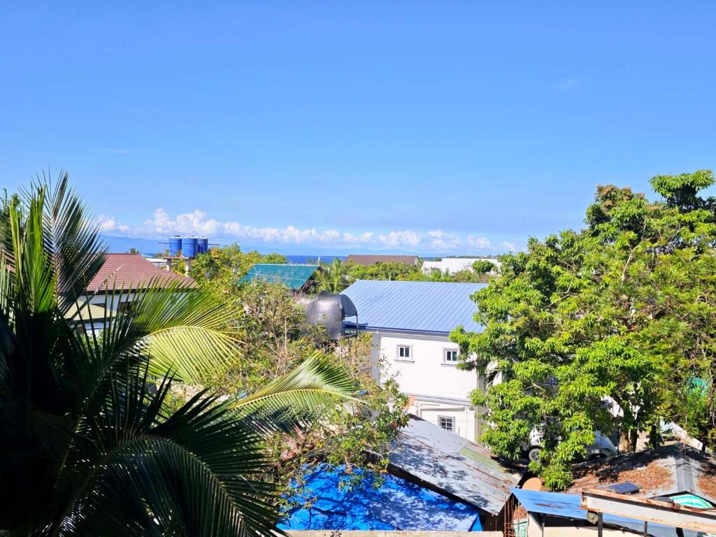 an aerial view of a building and trees at Moalboal Seaside Resort in Moalboal