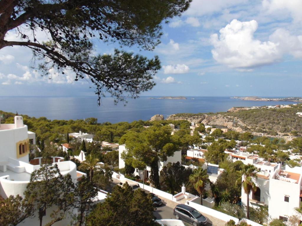 a view of the town of positano and the ocean at Apartamentos Miramar II in Cala Vadella