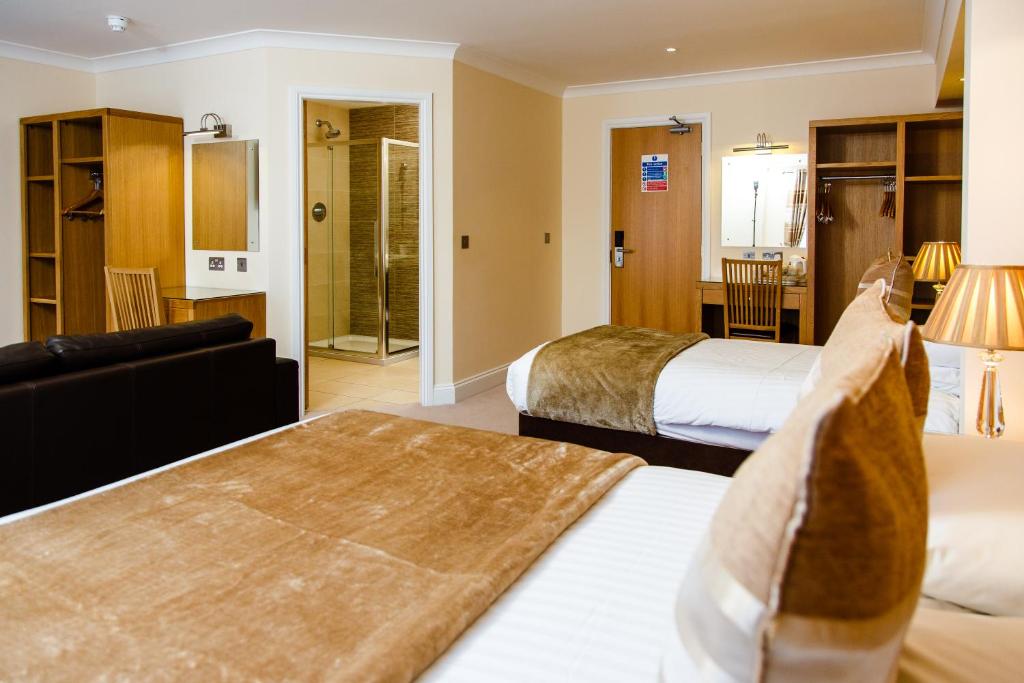 Postel nebo postele na pokoji v ubytování Adamson Hotel
