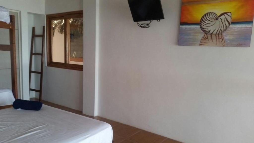 Postel nebo postele na pokoji v ubytování Las Tortuguitas Bungalows