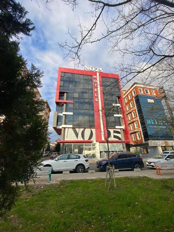 a building with cars parked in front of it at No25 Hotels in Çorlu