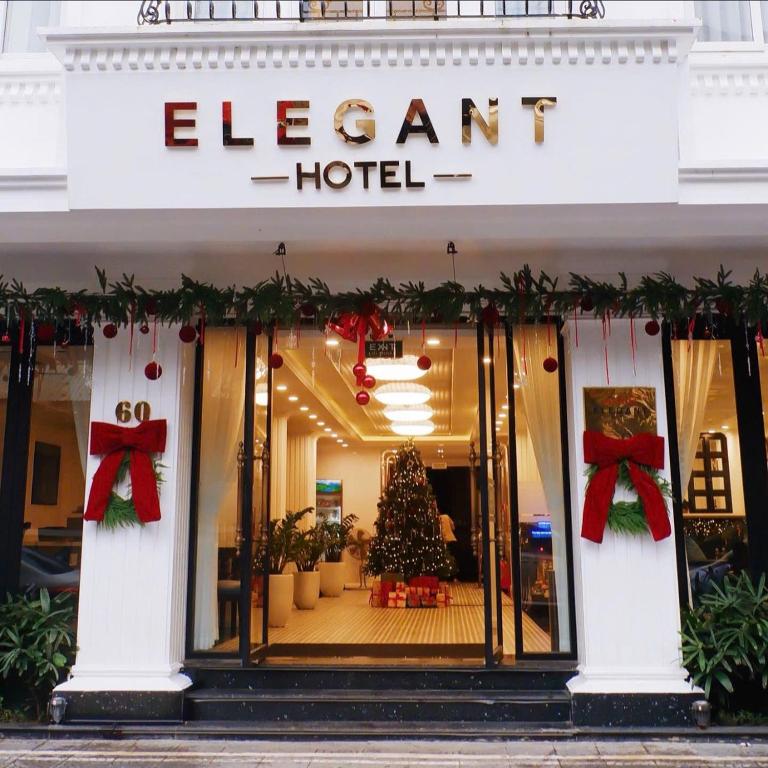 a store front of a hotel with a christmas tree at The Elegant Boutique - Hue in Hue