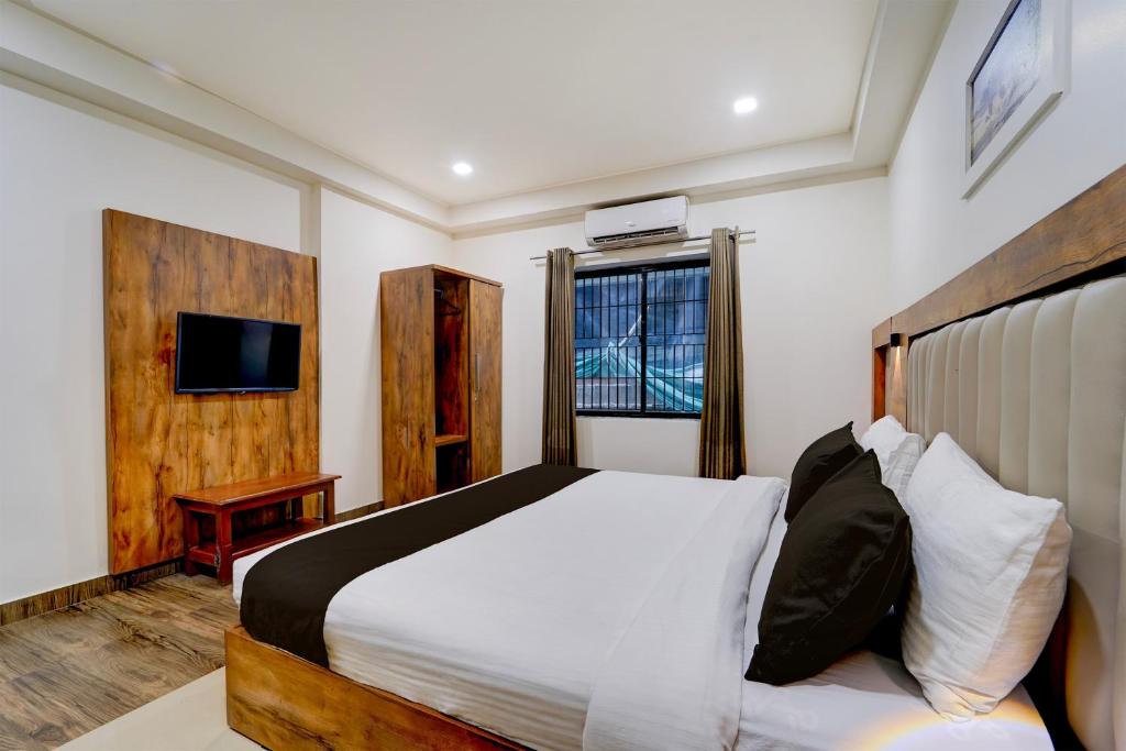 Giường trong phòng chung tại Hotel O OZONE Residency