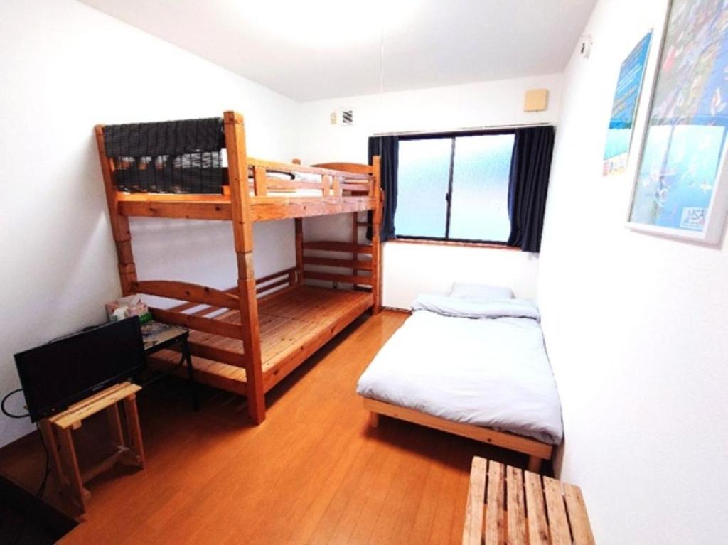 Giường trong phòng chung tại ＬＯＤＧＥ ｎ"ｔｒｉｂｅ - Vacation STAY 78135v