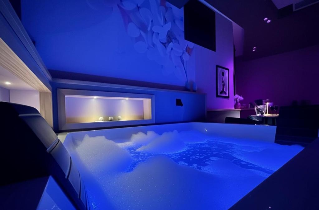 En eller flere senge i et værelse på Sumaiè Suite - Wellness in Salento