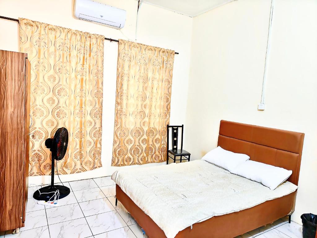 Postel nebo postele na pokoji v ubytování huazhi