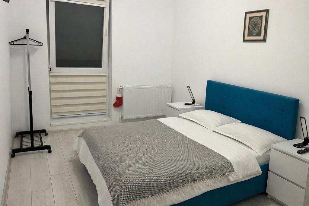 En eller flere senge i et værelse på Piatra Craiului Residence Zărnești