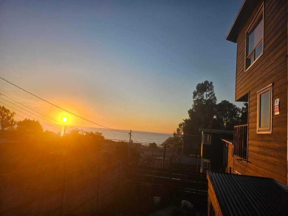a view of the sunset from a house at Loft playaBlanca in Coronel