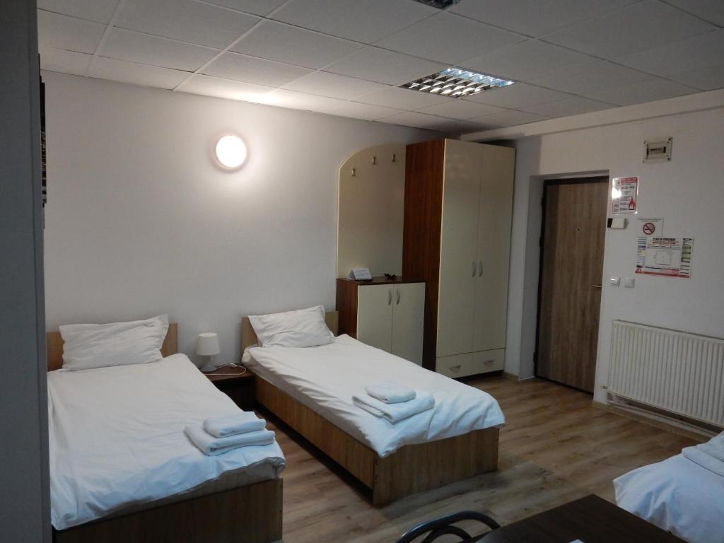 En eller flere senge i et værelse på Aparthotel Metropol