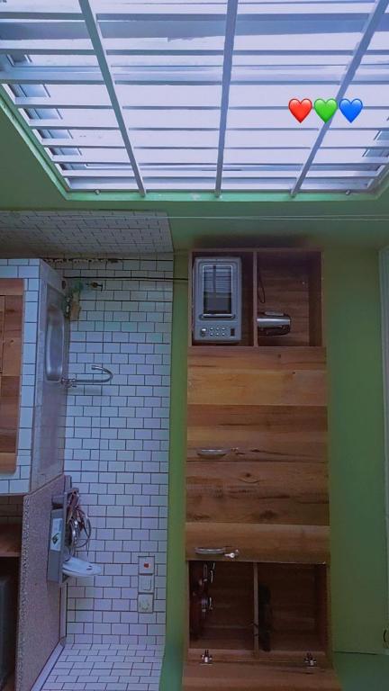 a kitchen with a ceiling with hearts on the wall at Juliebert plaza in Tema