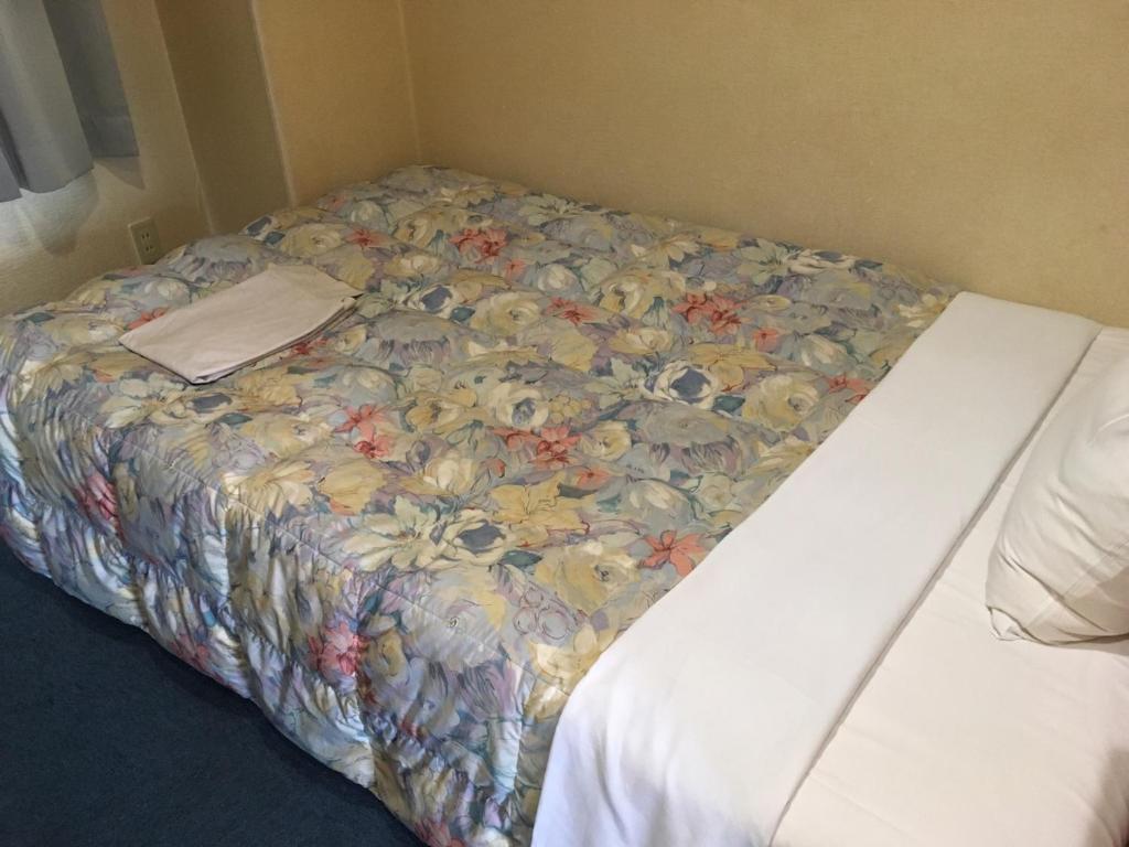Ένα ή περισσότερα κρεβάτια σε δωμάτιο στο Hotel Tajimi Hills Riverside