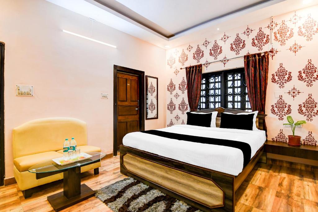 En eller flere senge i et værelse på Hotel O SPRINGWOODS HOSPITALITY