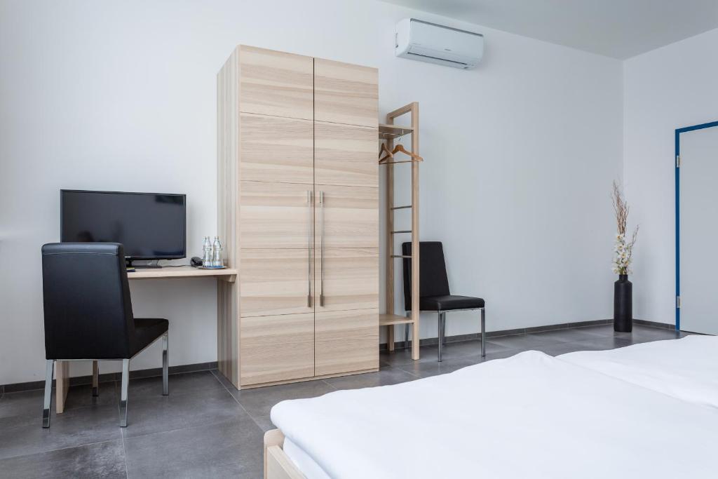 Postel nebo postele na pokoji v ubytování Turmöl Hotel