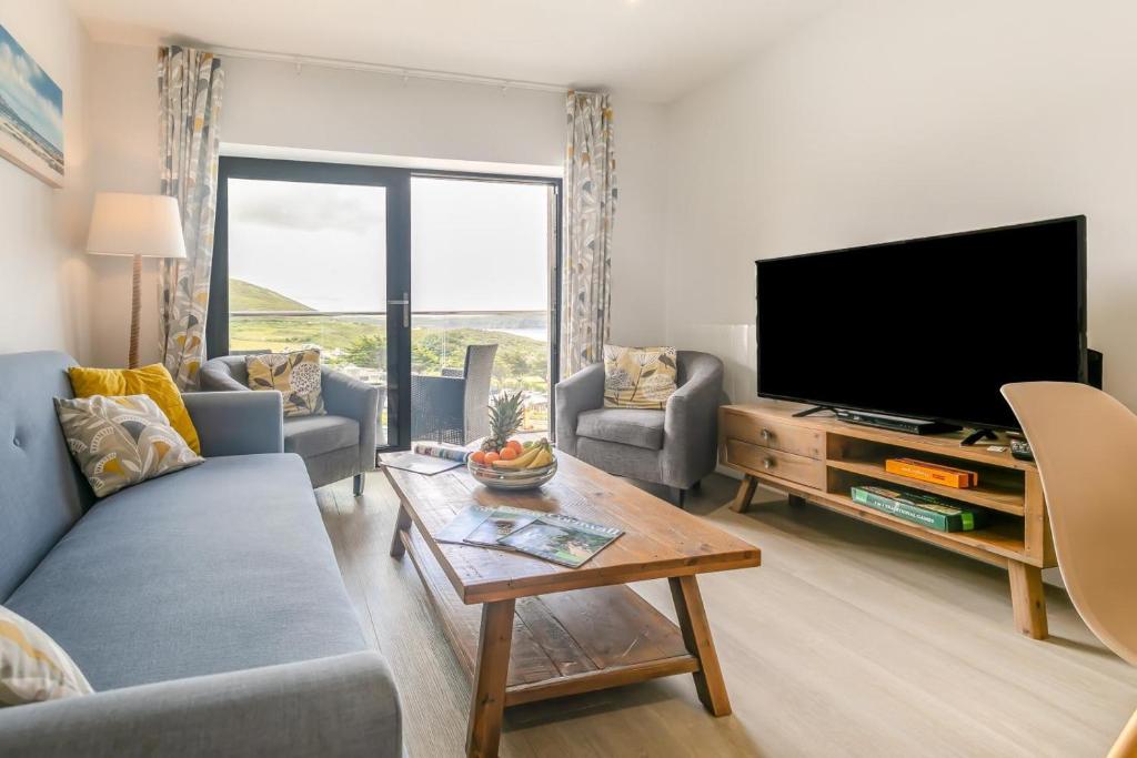 a living room with a couch and a tv at 3 Bed in Woolacombe oc-t29466 in Woolacombe