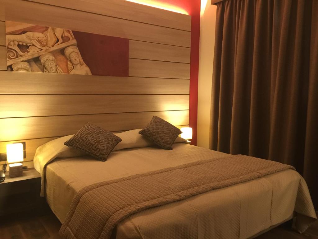 Posteľ alebo postele v izbe v ubytovaní Archeo Hotel