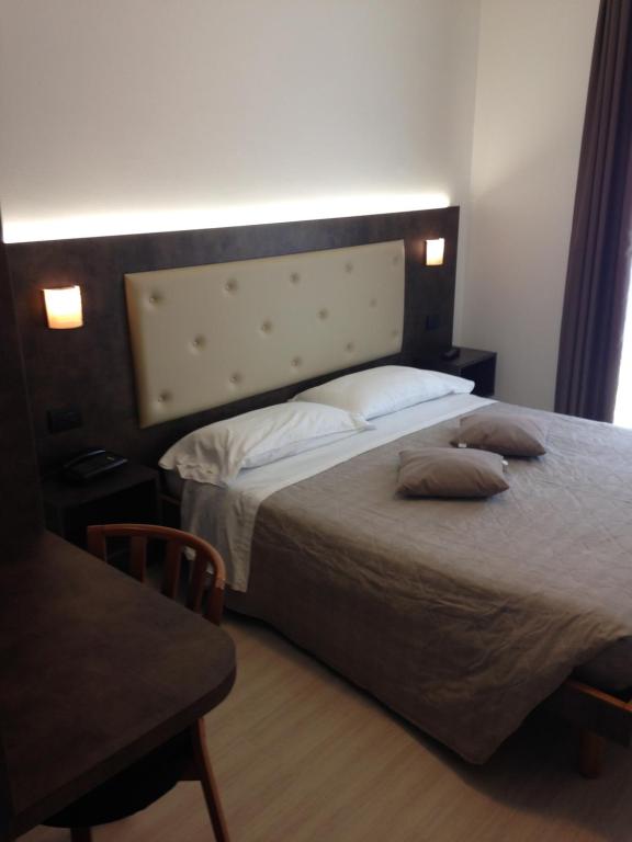 Postel nebo postele na pokoji v ubytování Albergo Ristorante Da Neni
