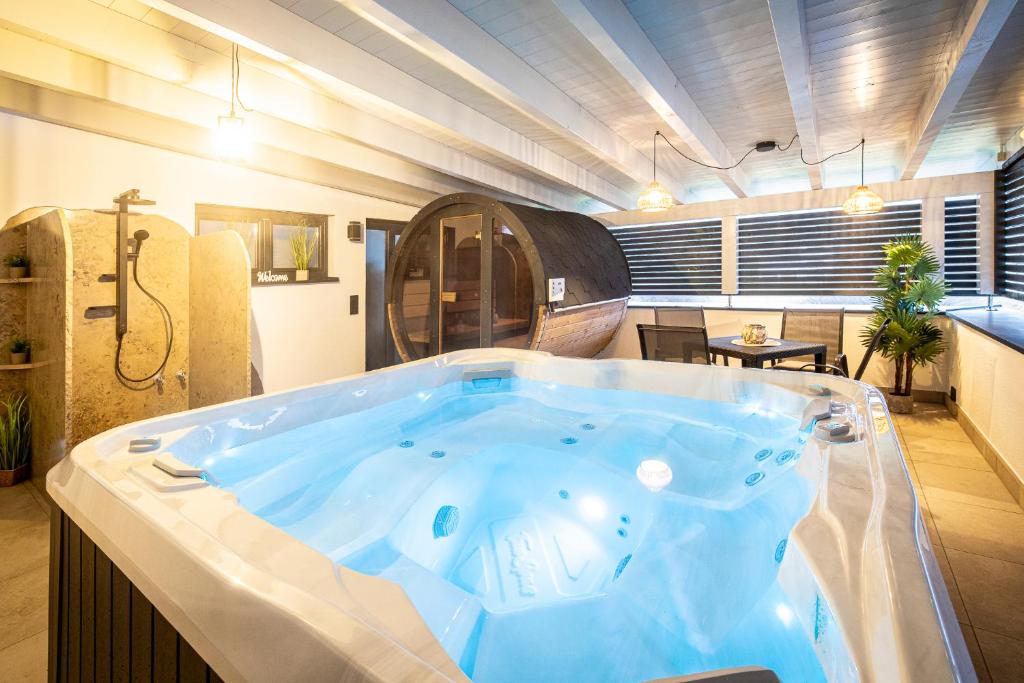 a jacuzzi tub in a room at Riedbach-Lodge 3 in Viechtach